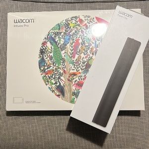 New never been opened Wacom Intuos Pro, Medium. And Wacom Paper clip